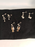 Pendientes Plateados con diferentes dijes
